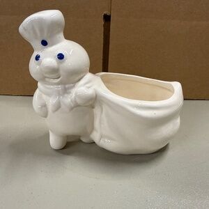 a vintage Pillsbury Doughboy ceramic planter or utensil holder from 1988